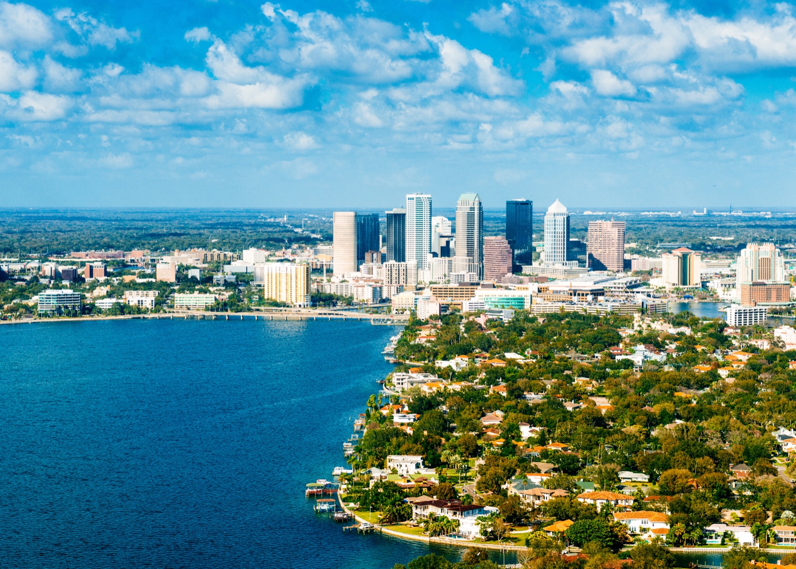 Downtown Tampa skyline and waterfront homes along the bay